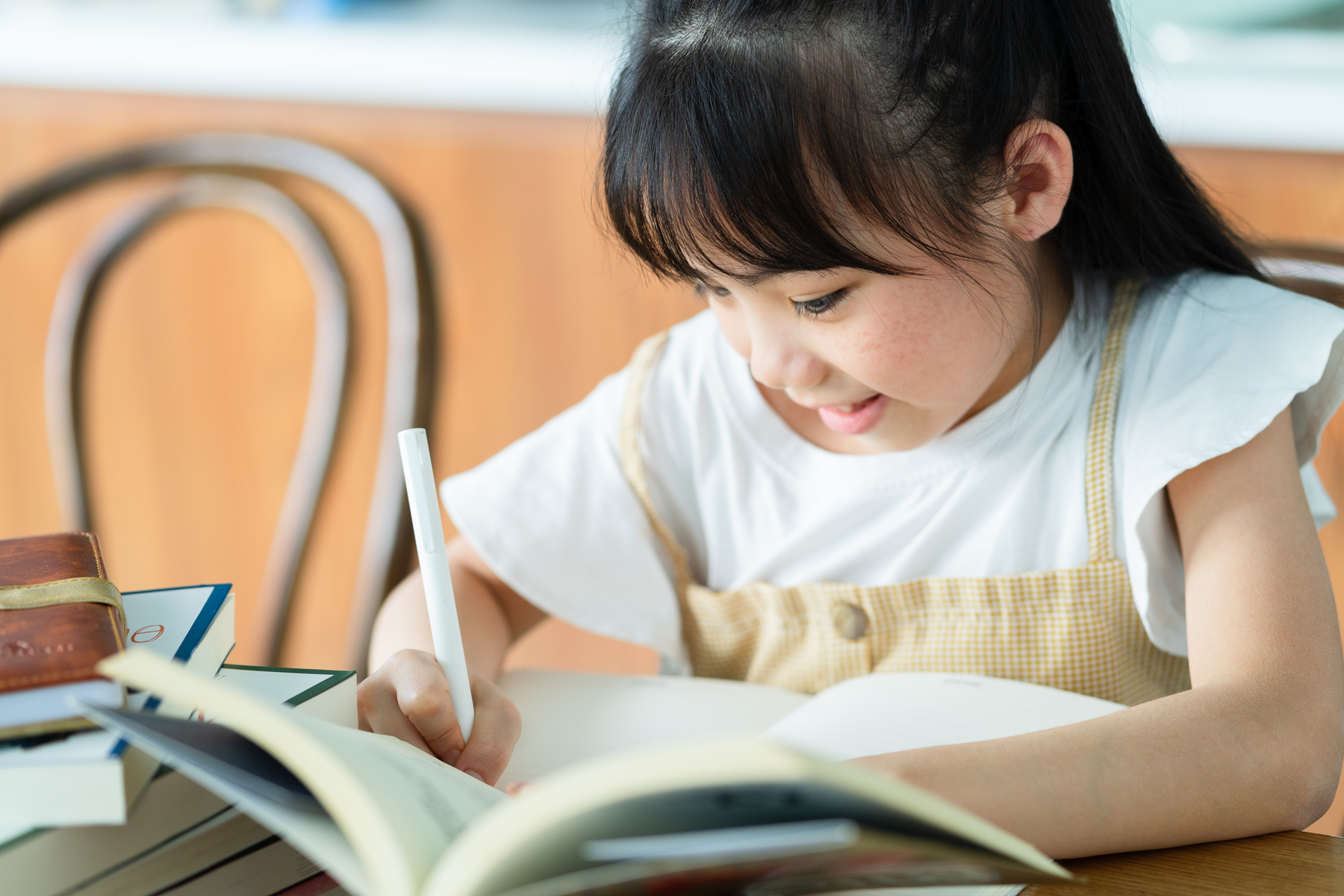 Asian Child Studying at Home